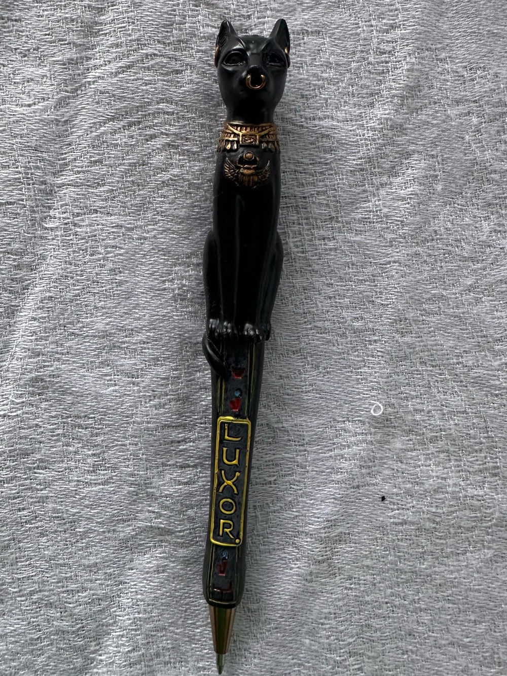 Egyptian goddess Bastet with detailed hieroglyphic styling.